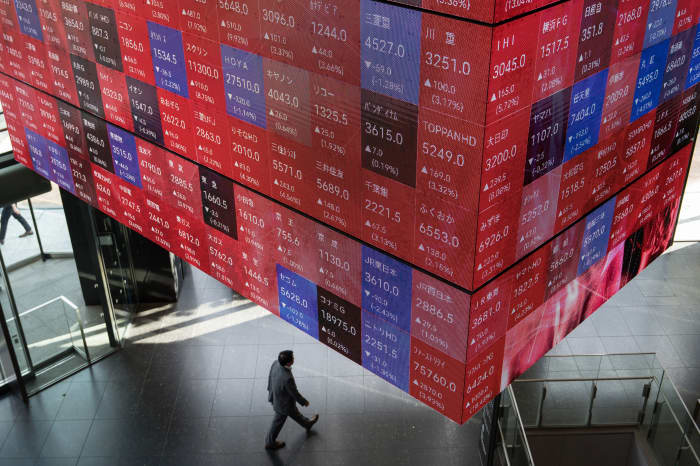 Tokyo stocks surge as Nikkei, Topix set new records