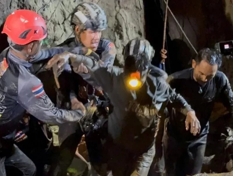 First of five men found alive in flooded Laos cave rescued 