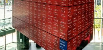 Japan's Nikkei hits record high on strong earnings boost