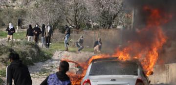 Israeli settlers set fire to mosque and cars in West Bank raids