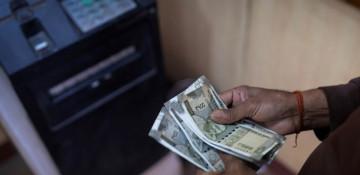 Indian rupee weakens to record low against US dollar