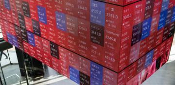 Tokyo stocks surge as Nikkei, Topix set new records