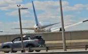 United Airlines plane hits truck and light pole on approach to Newark airport -  VIDEO 