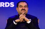 Why is the U.S. Justice Department considering dropping charges against Indian billionaire Gautam Adani?