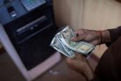 Indian rupee weakens to record low against US dollar