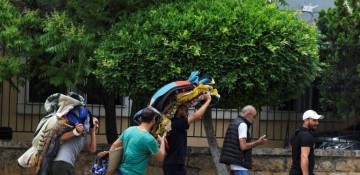  In Photos:  People flee southern Beirut after Israel's Netanyahu order strikes