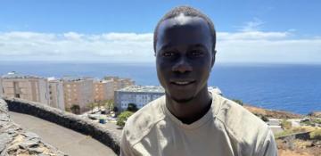 How did a Gambian teen survive seven days at sea en route to Europe?