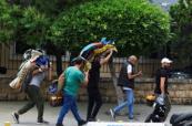  In Photos:  People flee southern Beirut after Israel's Netanyahu order strikes