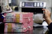 Indonesia's rupiah slides to record low against US dollar
