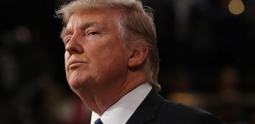 Trump signs revised travel ban order, leaves Iraq off