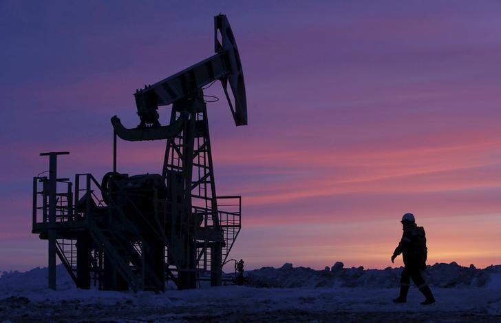 Oil futures supported by weaker dollar, but bloated supply still weighs