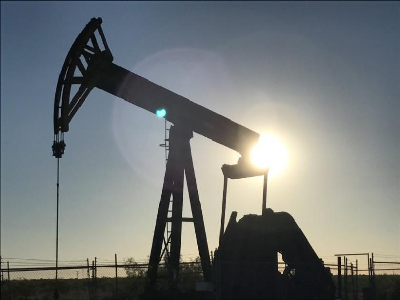 Oil rises one percent on weaker dollar, but U.S. drilling drags