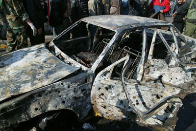 Syrian state TV says at least 8 killed, 12 wounded in Damascus blasts
