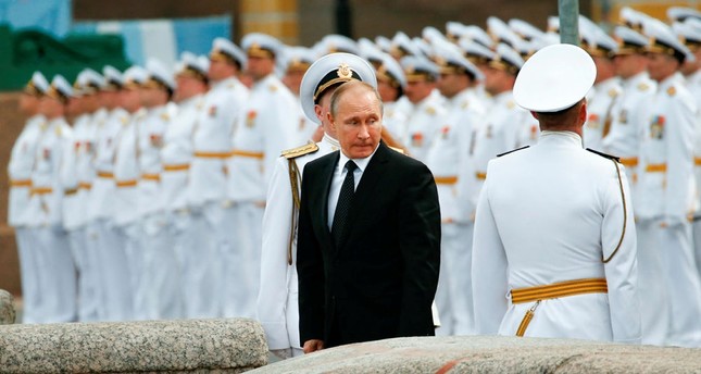 Putin says 755 US diplomats must leave Russia in retaliation for new US sanctions