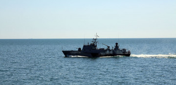 Artillery firings at a floating mine conducted within the 