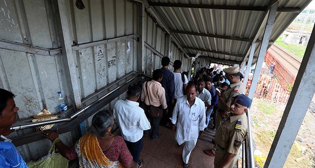 At least 22 dead, 32 injured in stampede on Indian pedestrian bridge