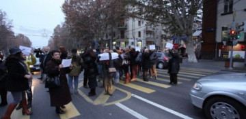 Protesters try to block the road in Yerevan