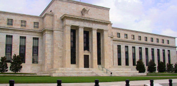 Fed holds interest rates steady, sees inflation rising this year