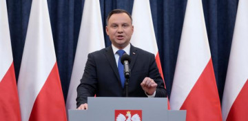 Poland's president says will sign Holocaust bill, defying critics  