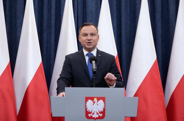 Poland's president says will sign Holocaust bill, defying critics  