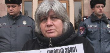 Mother of dead Armenian soldier holds solo protest outside government building