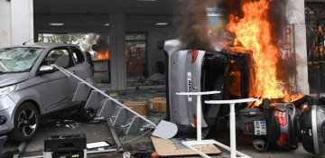 May Day riot in Paris: Masked protesters torch cars, police deploy tear gas
