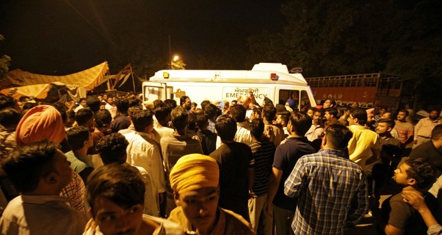 At least 50 killed after train runs over crowd in India