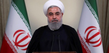 As US sanctions resume, Rouhani vows to keep selling oil