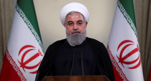 As US sanctions resume, Rouhani vows to keep selling oil