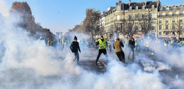 Riot police use teargas against protesters in Paris