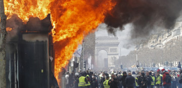 France bans some yellow vest protests in Paris after riots