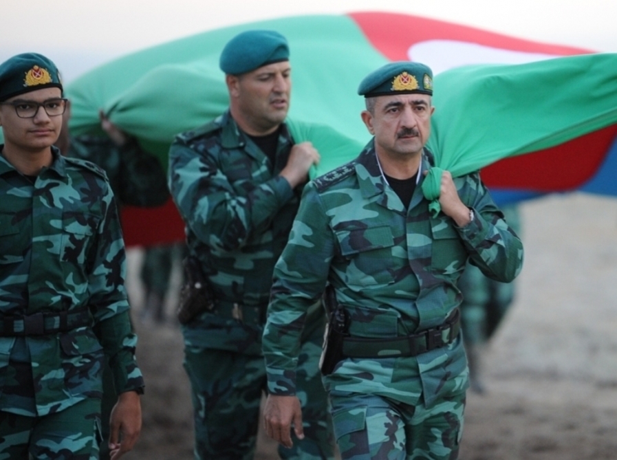 Azerbaijani border-guards march with 5 km 100 meter-long state flag