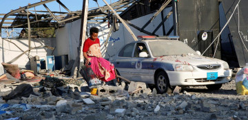 U.N. says Libyan guards reportedly shot at migrants fleeing air strikes