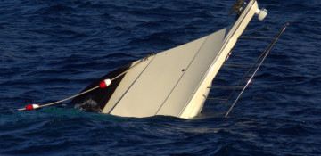Boat with more than 70 migrants capsizes off coast of Tunisia