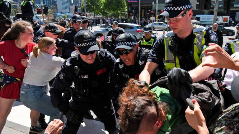 Dozens arrested as Australia mining protest turns violent