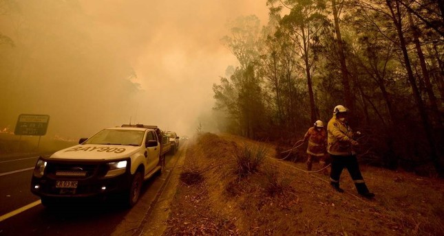 Thunderstorms bring relief and risk to Australian bushfires