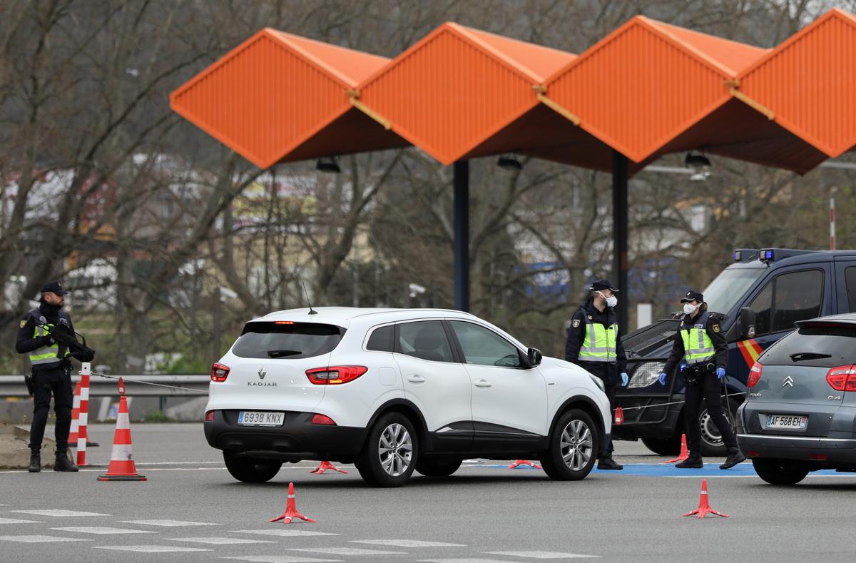 Spain turns back cars from land borders as coronavirus death toll rises to 491