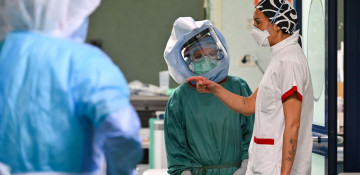 Italy's daily coronavirus death toll falls, but new cases accelerate