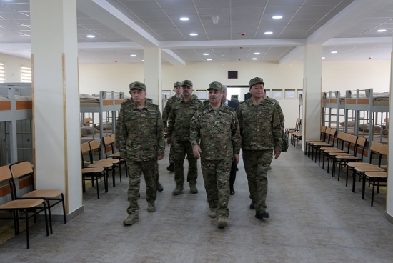 Azerbaijani defense minister, presidential aide visit foremost military unit under construction