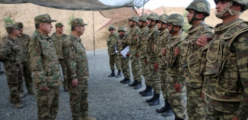 Azerbaijani defense minister, presidential aide visit another military unit on frontline