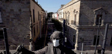 In photos: Even statues getting masked up across the globe