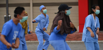 Photos of the Week: Yoga Dome, Iron Lady, Speedo Mick