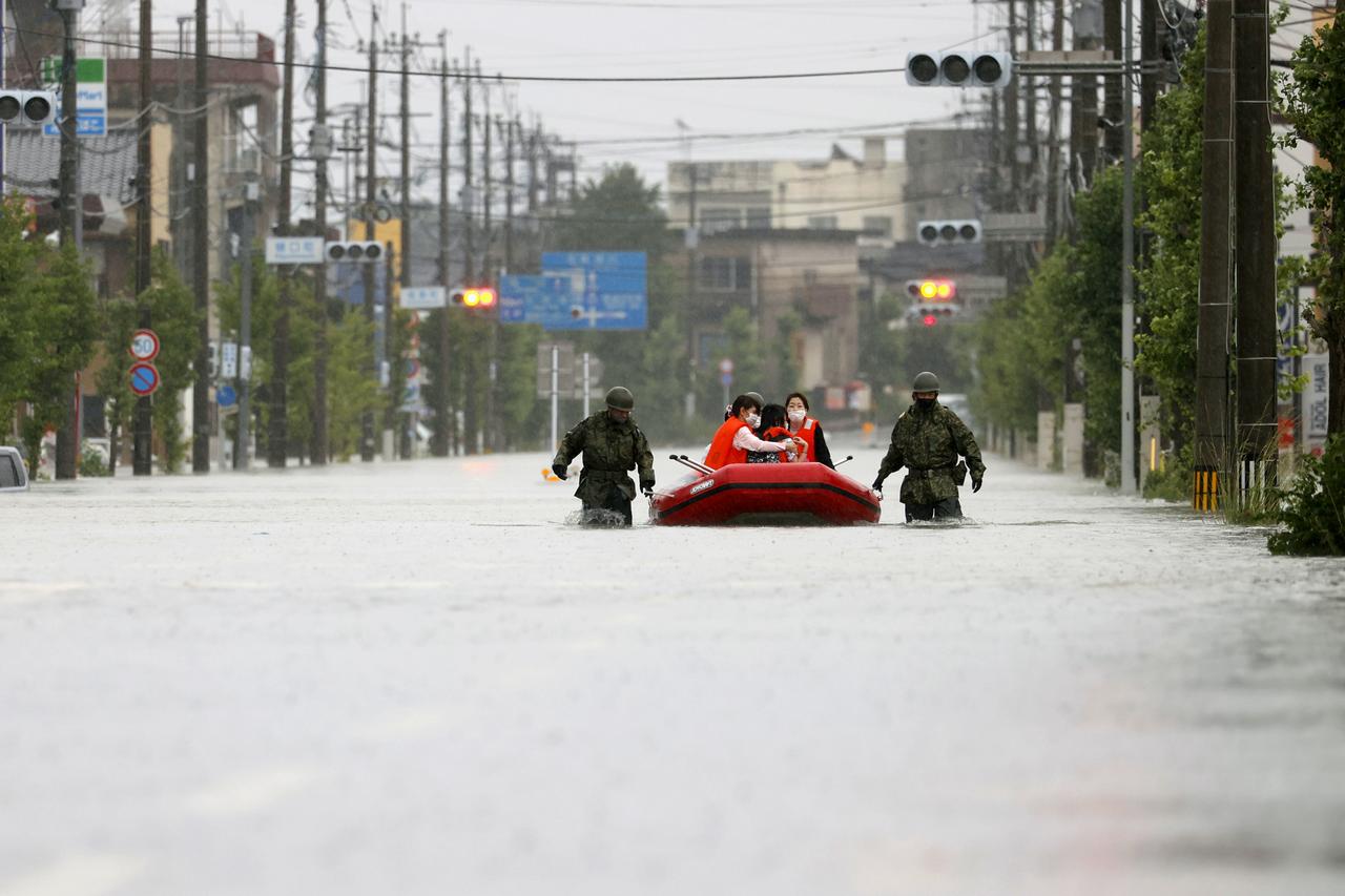 Japan boosts rescue efforts as it warns of more rain in flood-hit areas
