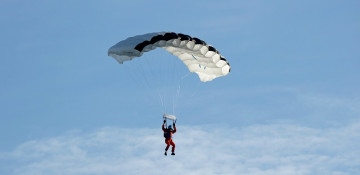 Swiss test pilot makes world's 1st jump from solar-powered plane