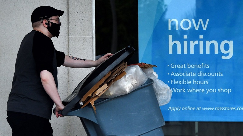 US jobless claims fall to 881,000 but layoffs remain high