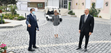 President Ilham Aliyev and first lady Mehriban Aliyeva view landscaping work carried out in Balakhani settlement