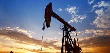 Oil rises to touch $52 after Trump signs aid bill