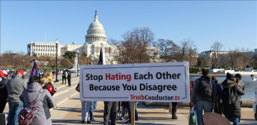 US rioter who posed on Pelosi's desk taken into custody