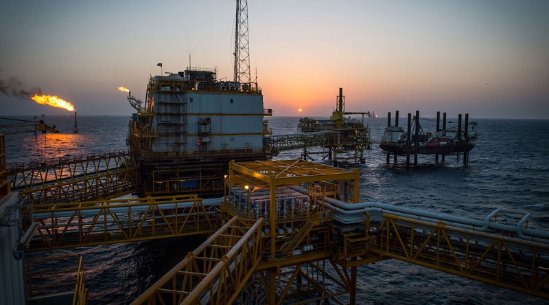 Oil hits more than one-year high on supply cuts, stimulus hopes