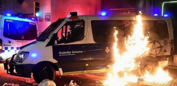 Catalan police arrest 8 in protests for jailed rapper